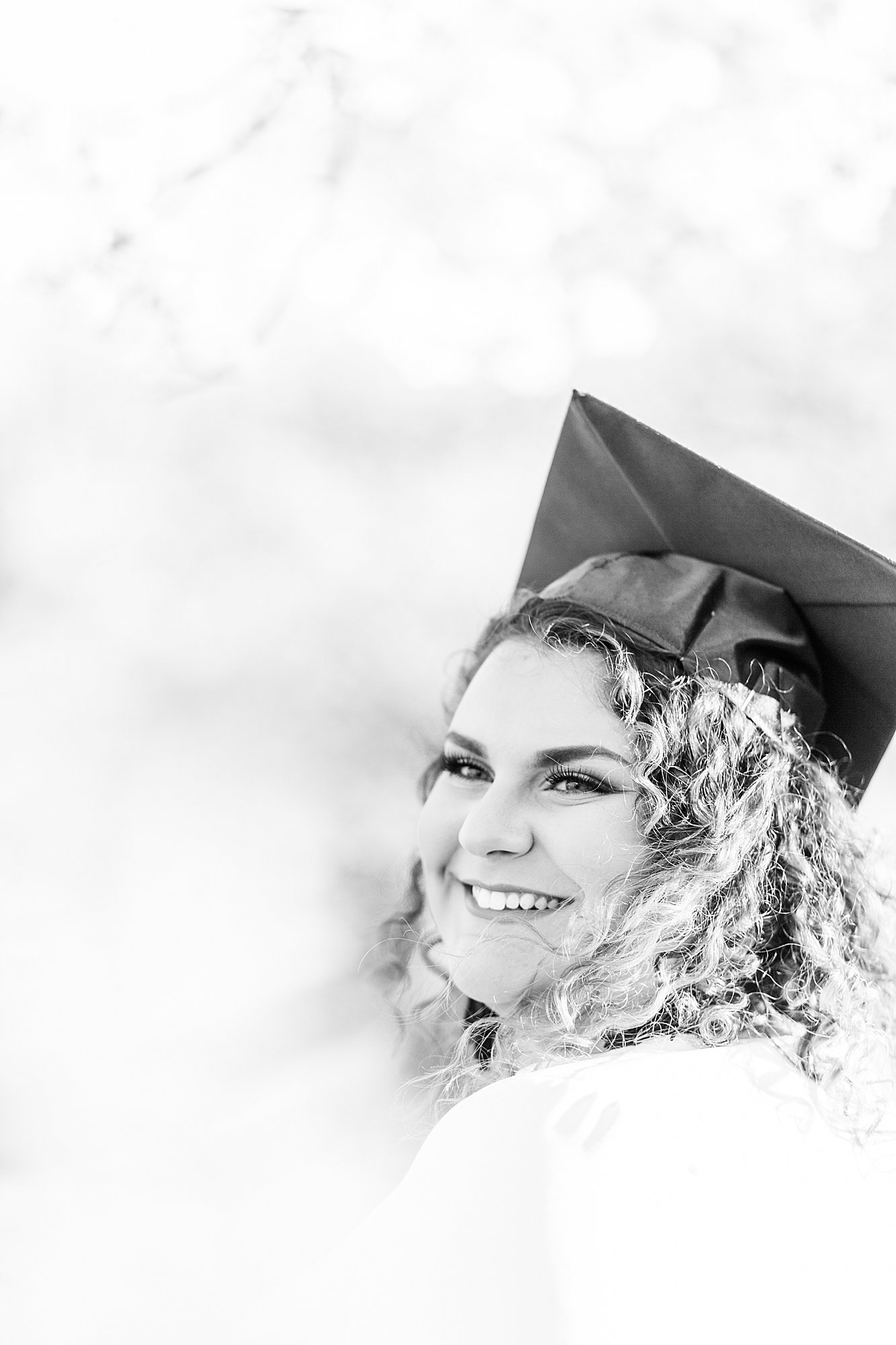 Black and white graduation photo in Spring.