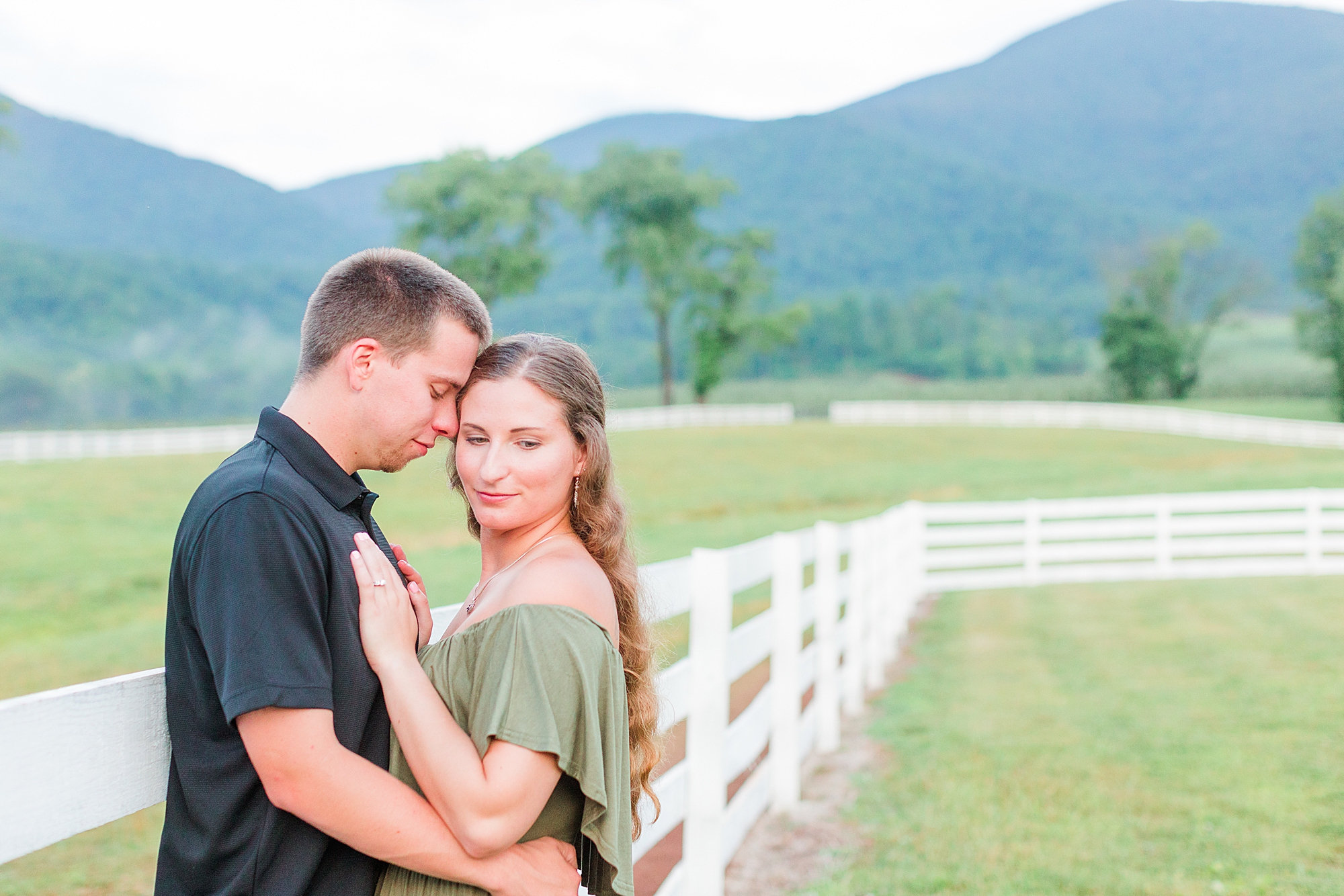 Beautiful location for Virginia engagement photos. Couple is holding hands walking towards camera.