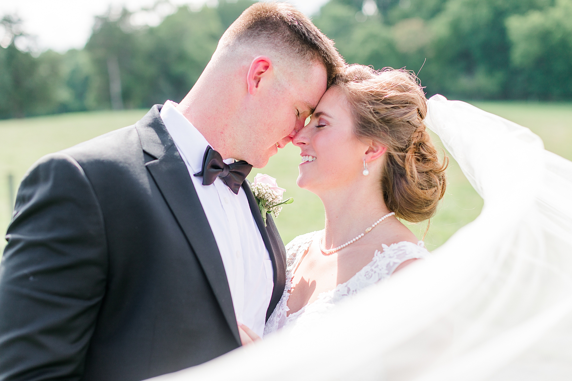 Bride and Groom portraits with veil flying in Northern Virginia.