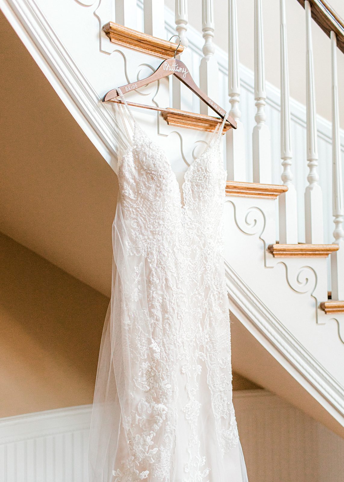 Wedding dress hanging up in Irvine Estates stairwell. 