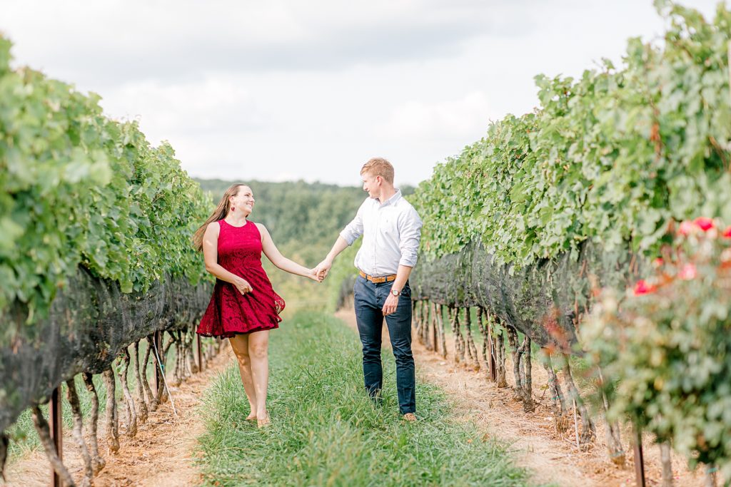 Couple dancing in the vines at Stone Tower Winery.