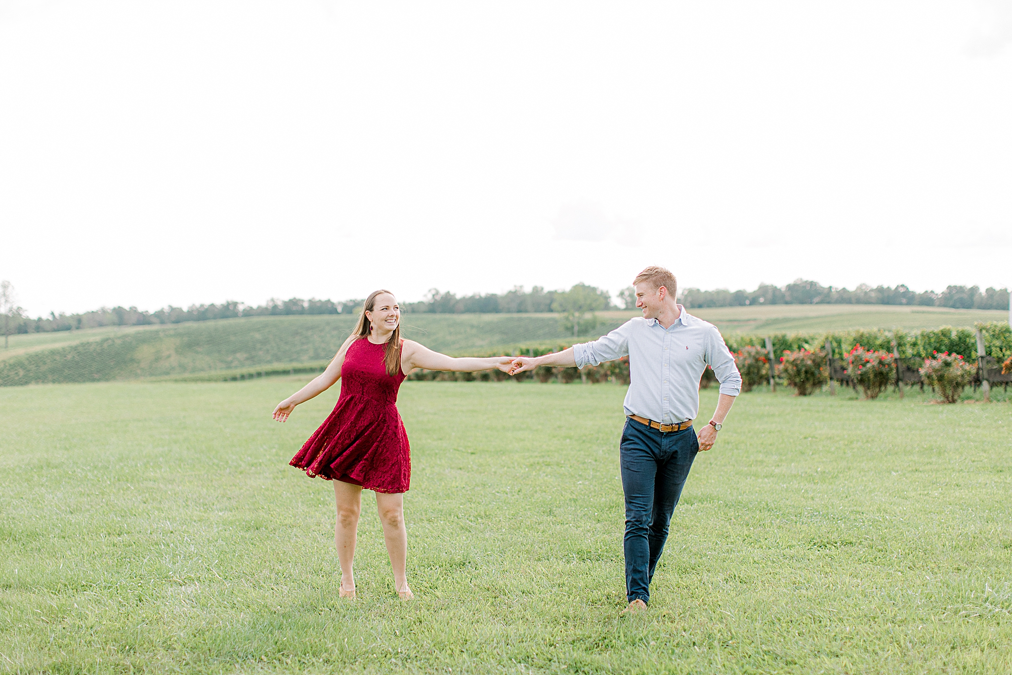 Couple dancing at Stone Tower Winery for engagement photos.