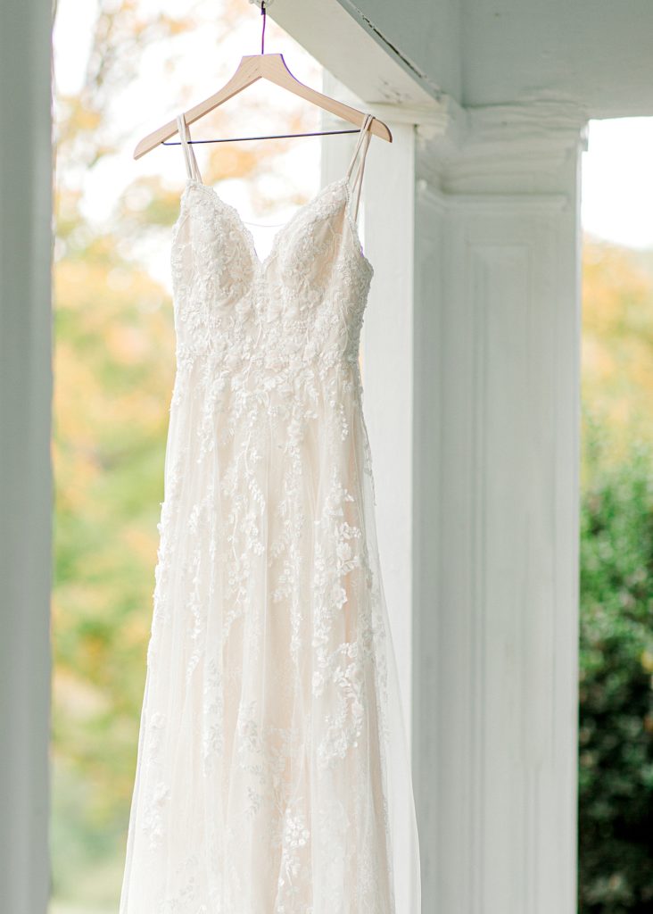 Wedding dress hanging on porch.