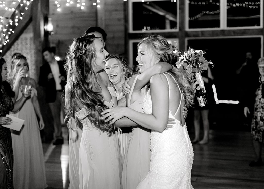 Bride dancing with bridesmaids.