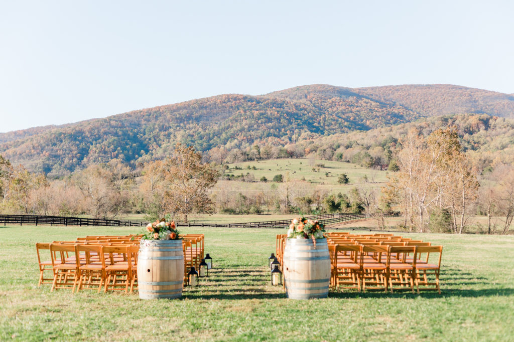 Ceremony set up for November wedding at King Family Vineyards. Wood barrel decorations for ceremony taken by Ashley Eagleson Photography.