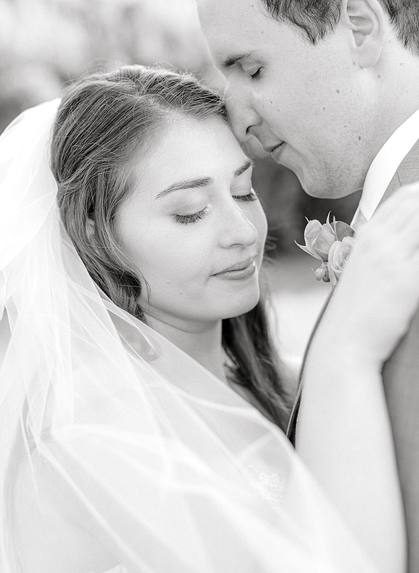 Black and white portrait of bride and groom.