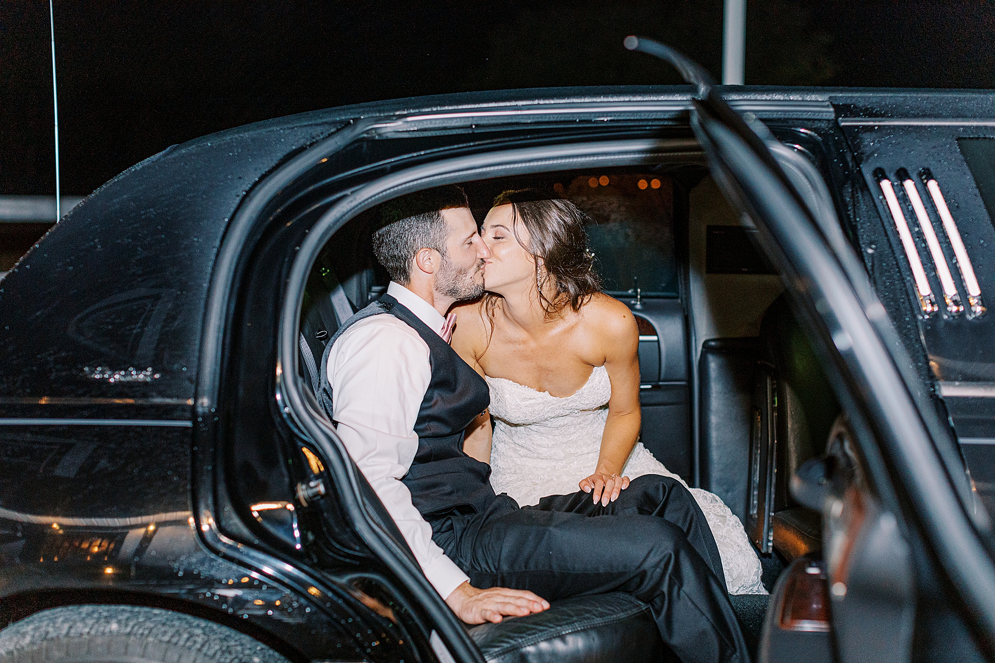 Bride and groom in limo.