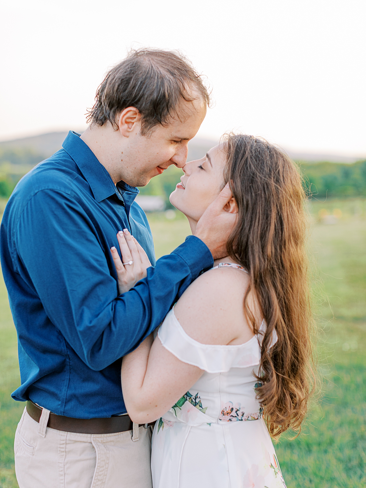 Engagement photos of couple taken near Charlottesville, Virginia in garden by Ashley Eagleson Photography.