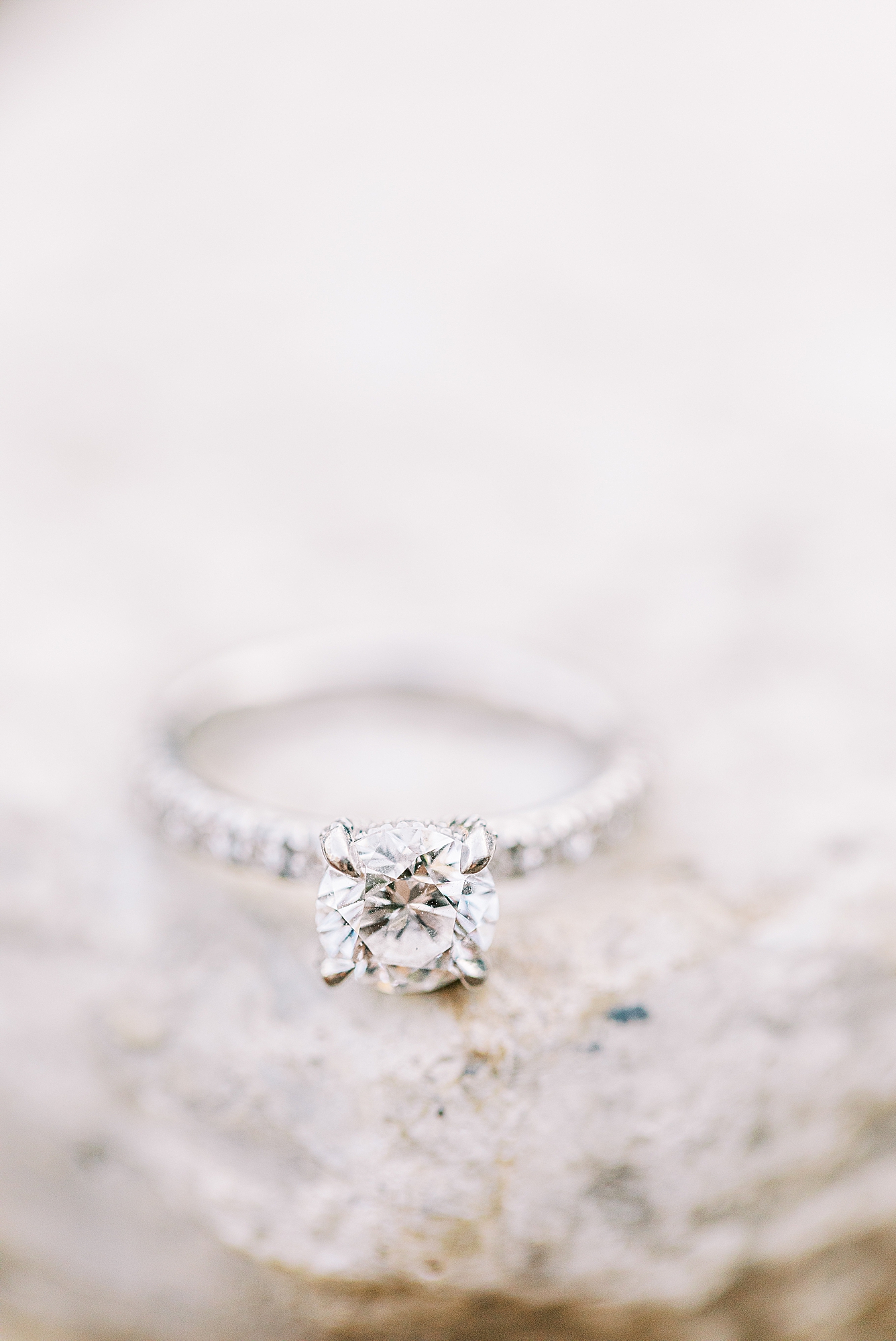 Silver engagement ring with diamond band.