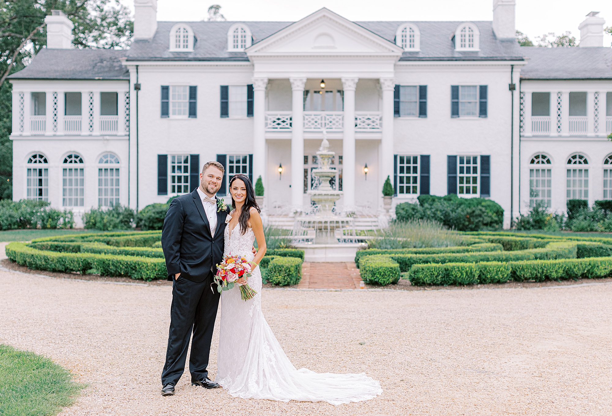 Traditional smiling portraits of bride and groom at wedding venue in Charlottesville.