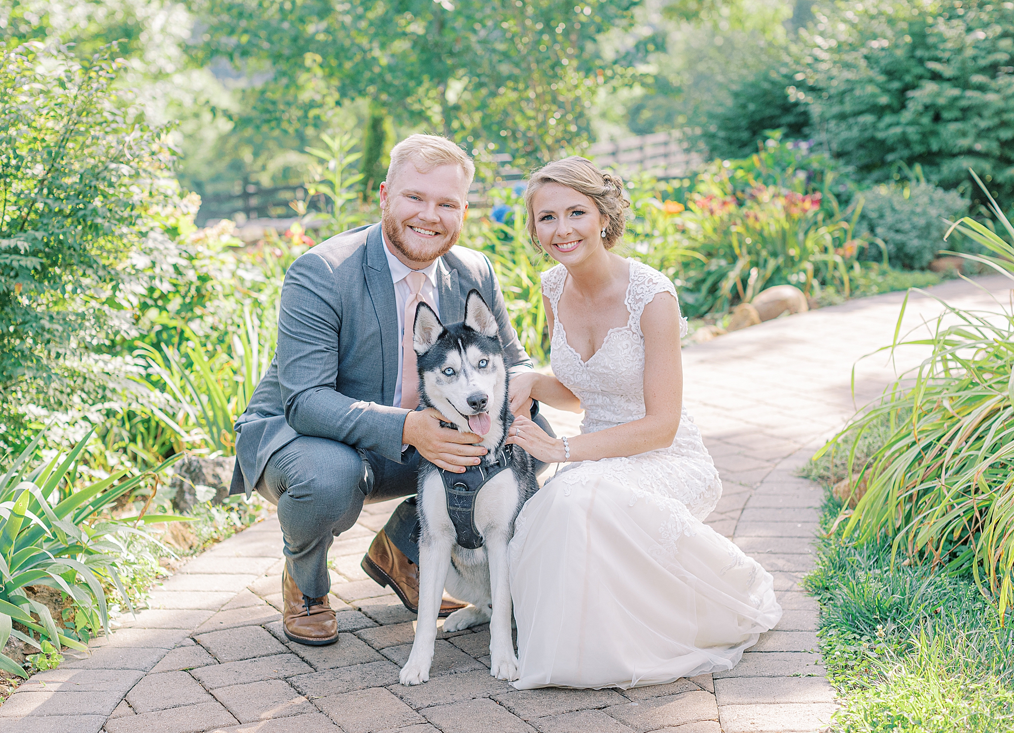 Bride and groom photos with dog.