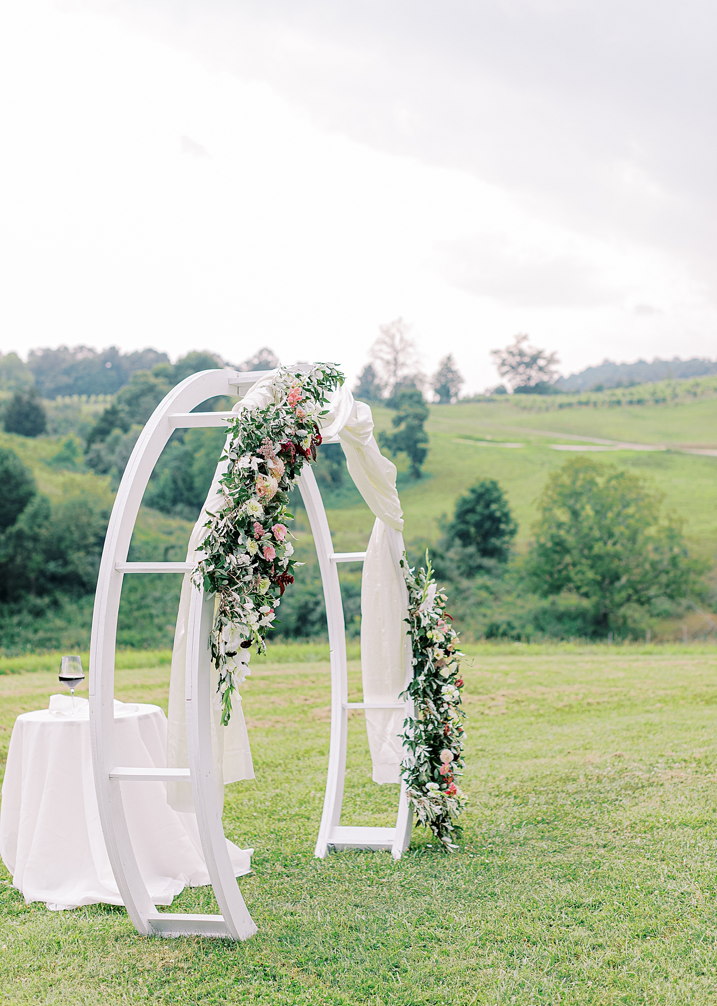 Floral arch at wedding ceremony.