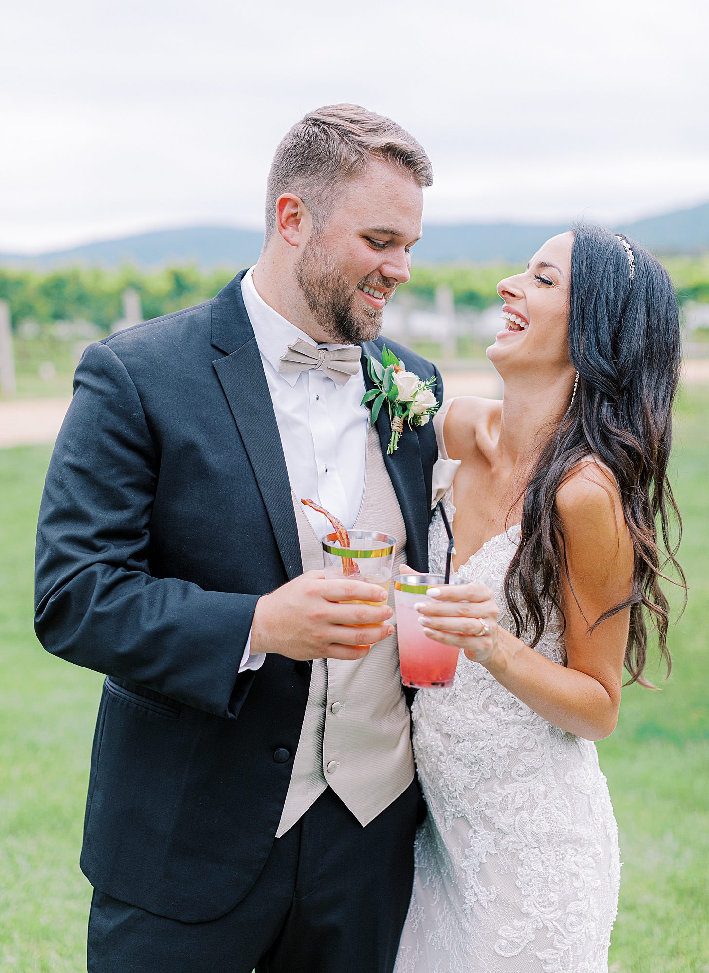 Bride and groom with signature cocktail.