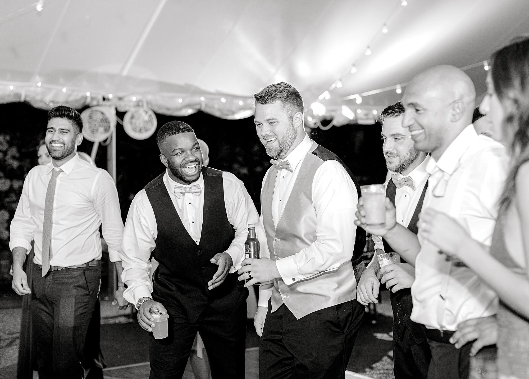 Guests dancing at wedding reception.