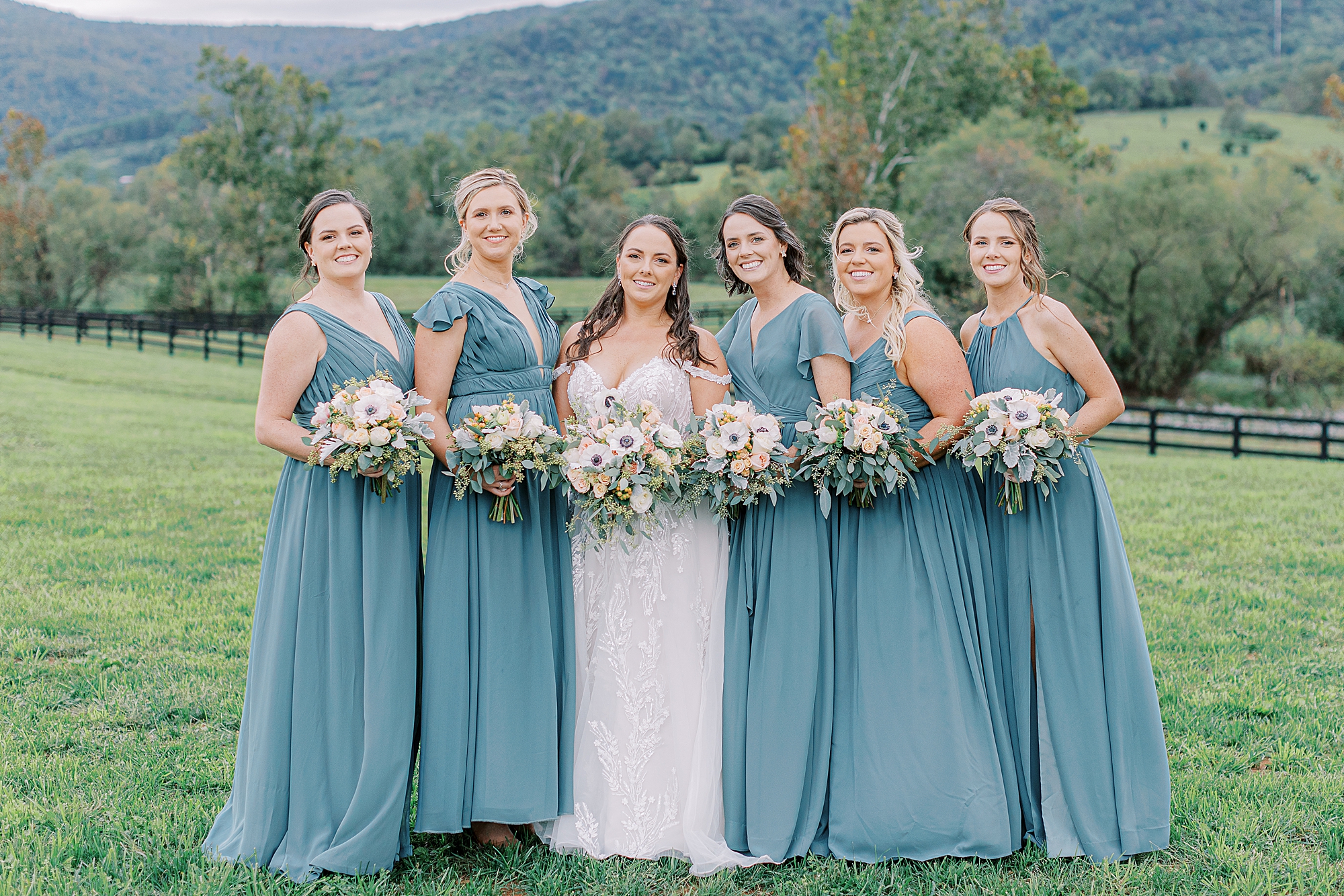 Bridesmaids wearing blue at Fall wedding.