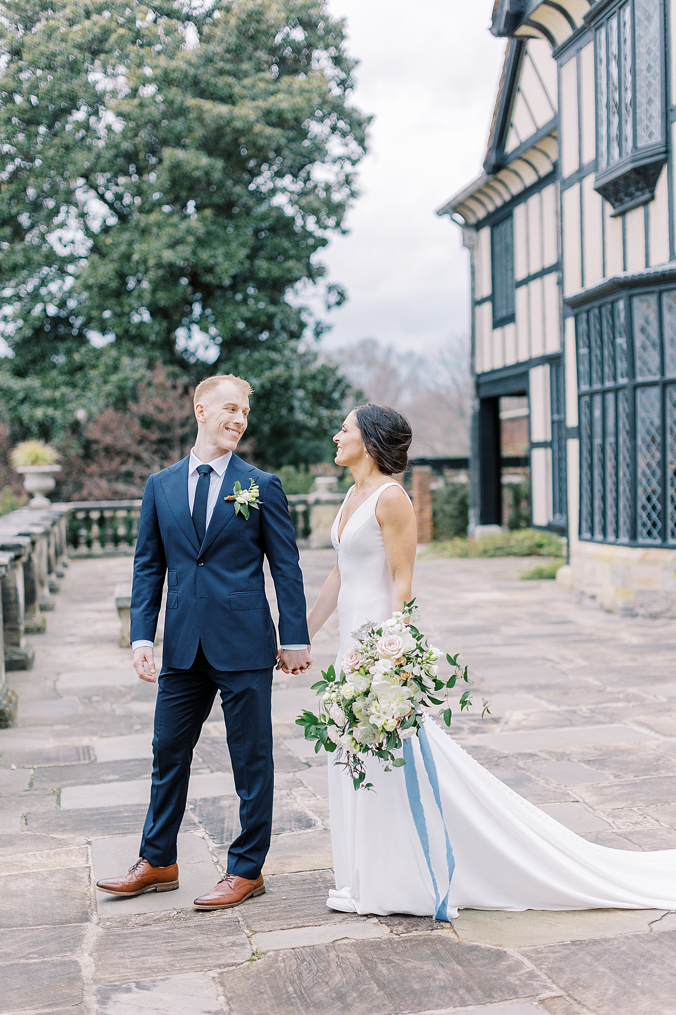 Groom leading bride at Agecroft Hall taken by Richmond wedding photographer.