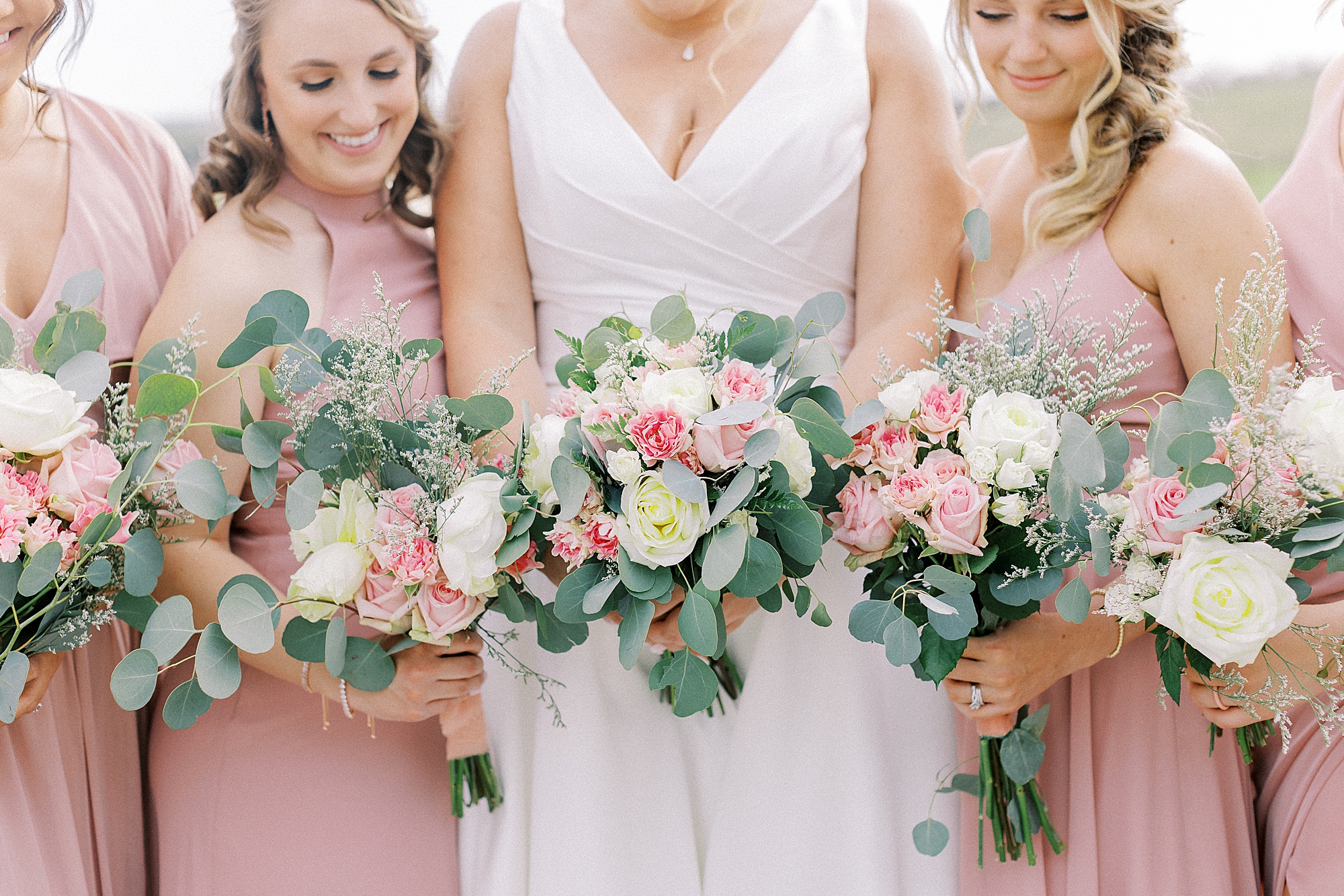 Bouquets with eucalyptus and blush roses.