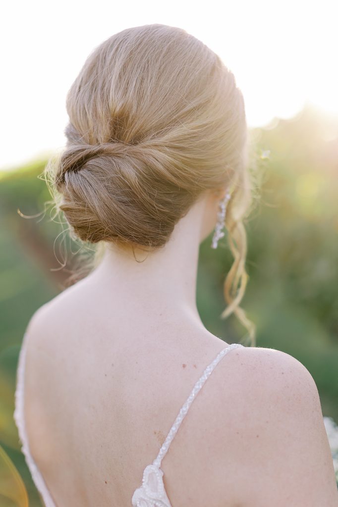 Low bun hairstyle on bride.