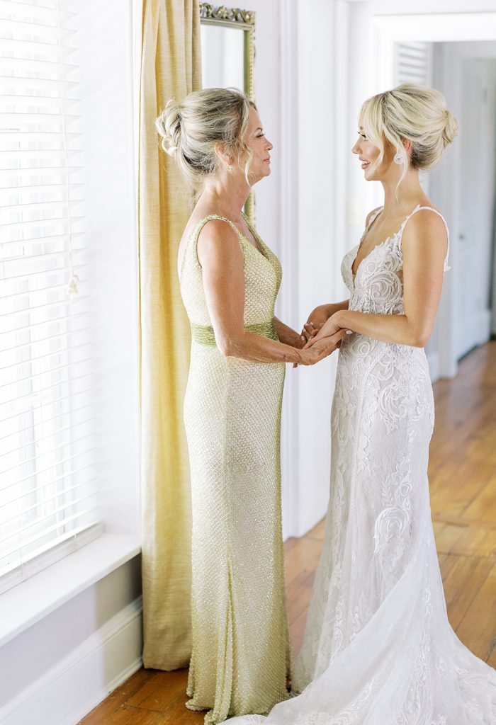 Bride and mother share a moment.