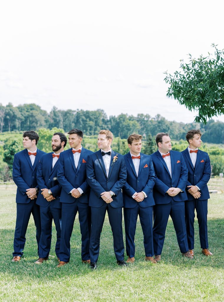 Groom and groomsmen in blue suits.