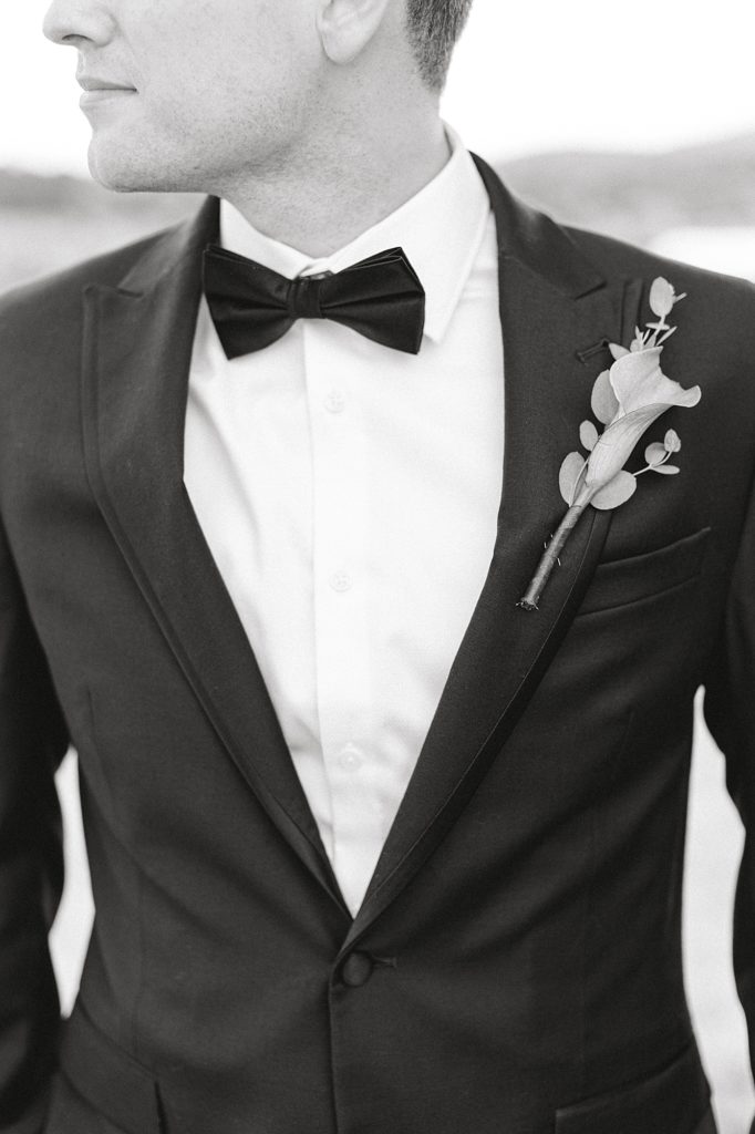 Black and white portrait of groom.
