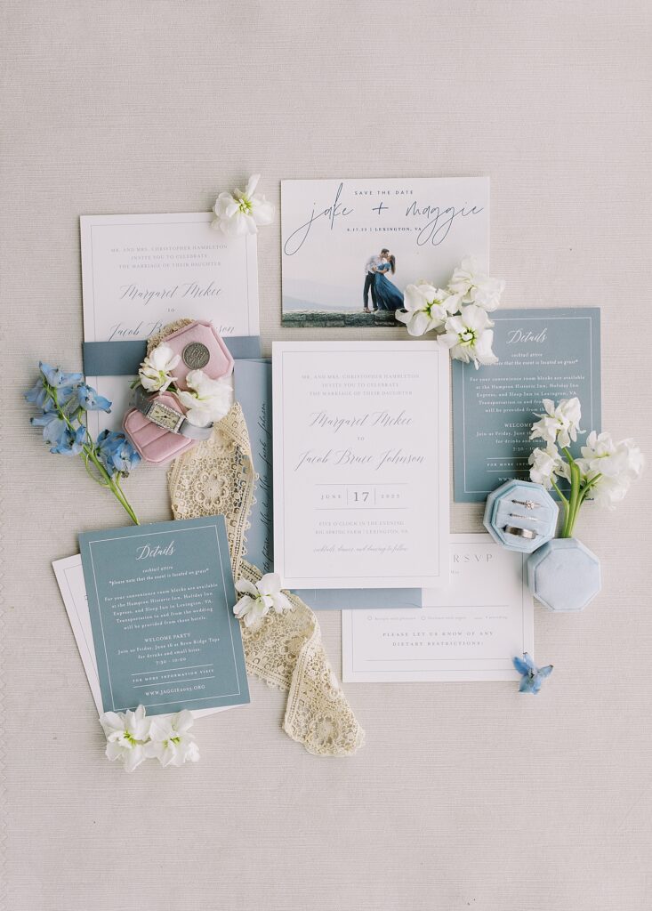 Dusty blue wedding invitation suite.