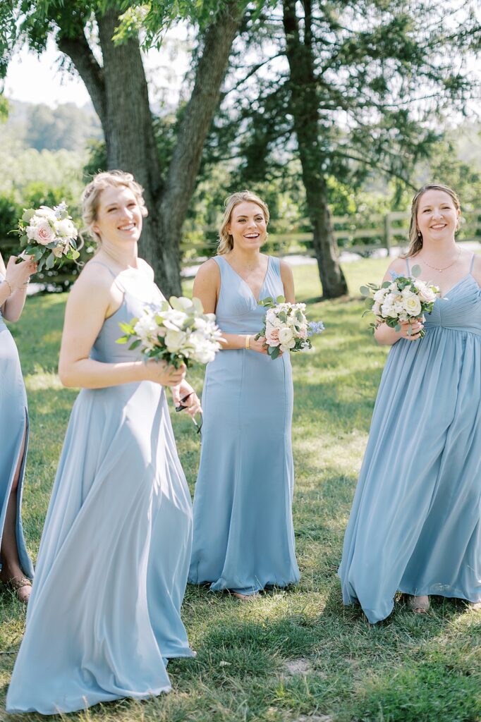 Candid of bridesmaids laughing.