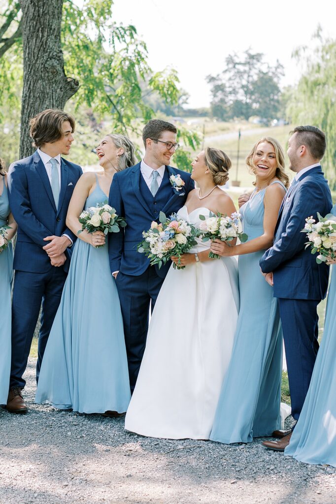 Wedding party wearing dusty blue.