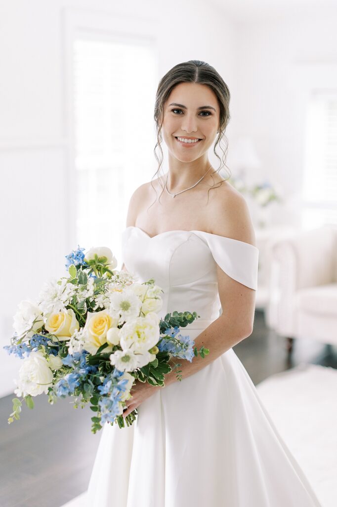 Bridal portrait at Veritas Vineyard Wedding with bride holding bouquet inspired by Spring colors.