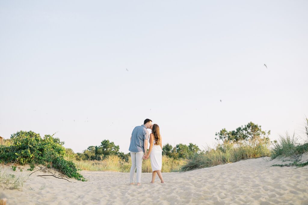 Portrait of couple in the dunes during their Virginia Beach engagement session.